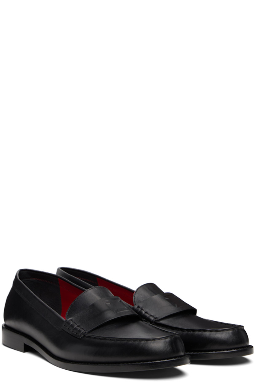 Buffed calfskin loafers.

· Moc toe
· Logo-embossed strap at vamp
· Logo embossed at heel counter
· Calfskin sole

Supplier color: Black
