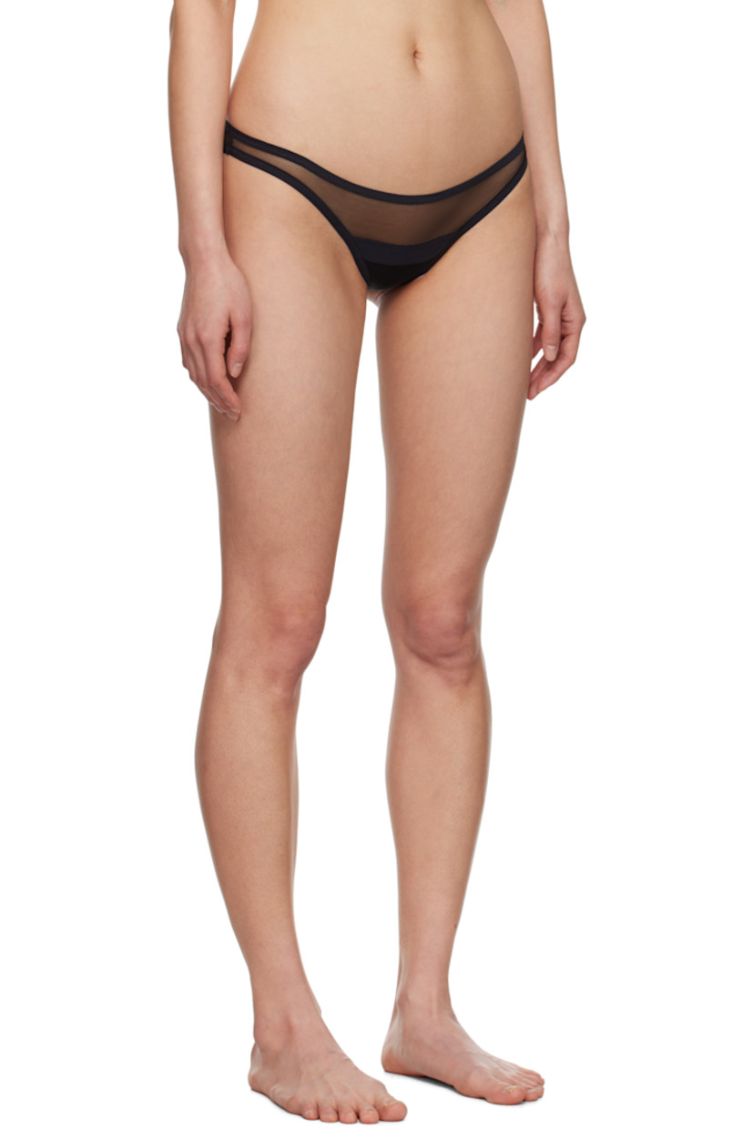Semi-sheer stretch nylon-blend tulle thong.

· Elasticized waistband
· Partial jersey lining

Supplier color: Black