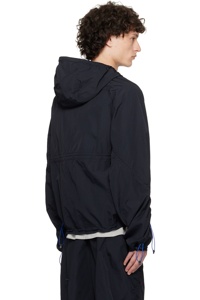 Lightweight nylon ripstop jacket. Bungee-style drawstring at hood, hem, sleeves, cuffs, and back.

· Zip closure
· Logo printed at chest
· Zip pockets 
· Elasticized hem and cuffs
· Raglan sleeves

Supplier color: Onyx