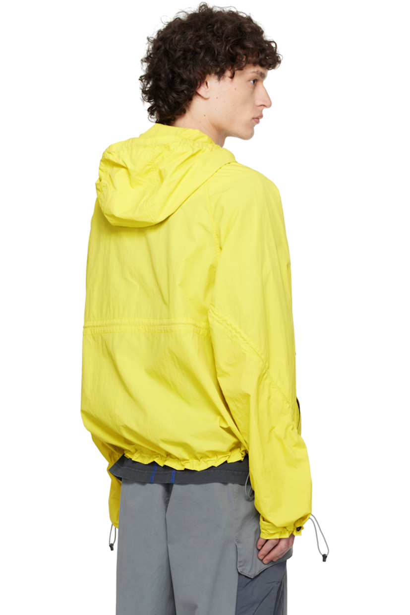 Lightweight nylon ripstop jacket. Bungee-style drawstring at hood, hem, sleeves, cuffs, and back.

· Zip closure
· Logo printed at chest
· Zip pockets
· Elasticized hem and cuffs 
· Raglan sleeves

Supplier color: Citronelle