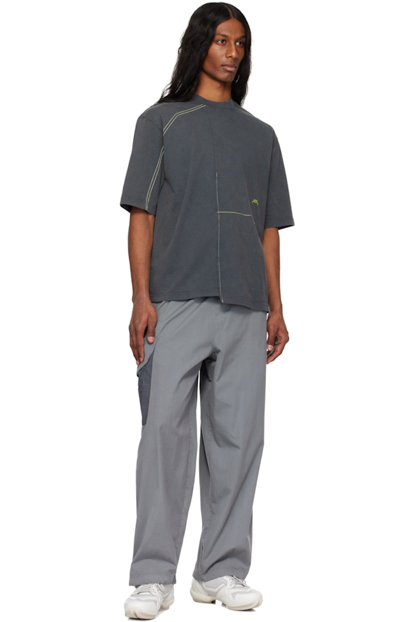 Plain-woven cotton cargo pants.

· Drawstring at elasticized waistband
· Two-pocket styling
· Poplin flap pocket with printed logo at outseam

Supplier color: Grey stone