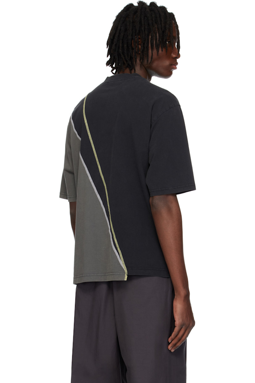 Rinse-washed 210 gsm cotton jersey T-shirt.

· Rib-knit crewneck
· Logo embroidered at front
· Asymmetric hem 
· Dropped shoulders
· Contrast overlock stitching in yellow and white

Supplier color: Black onyx