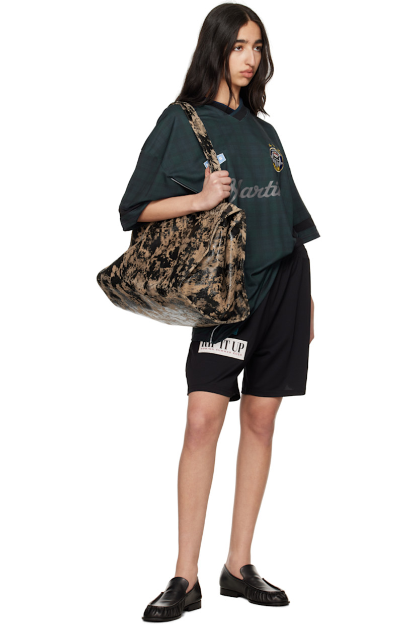 Polyester jersey shorts. 

· Embroidered graphic patches throughout
· Concealed drawstring at elasticized waistband

Supplier color: Black