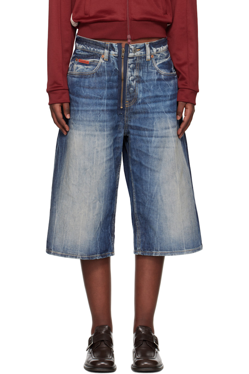 Non-stretch denim shorts. Bleaching, fading, and whiskering throughout. 

· Belt loops
· Five-pocket styling
· Exposed zip-fly
· Logo patch embroidered at coin pocket
· Logo patch at back waistband
· Contrast stitching in tan

Supplier color: Blue