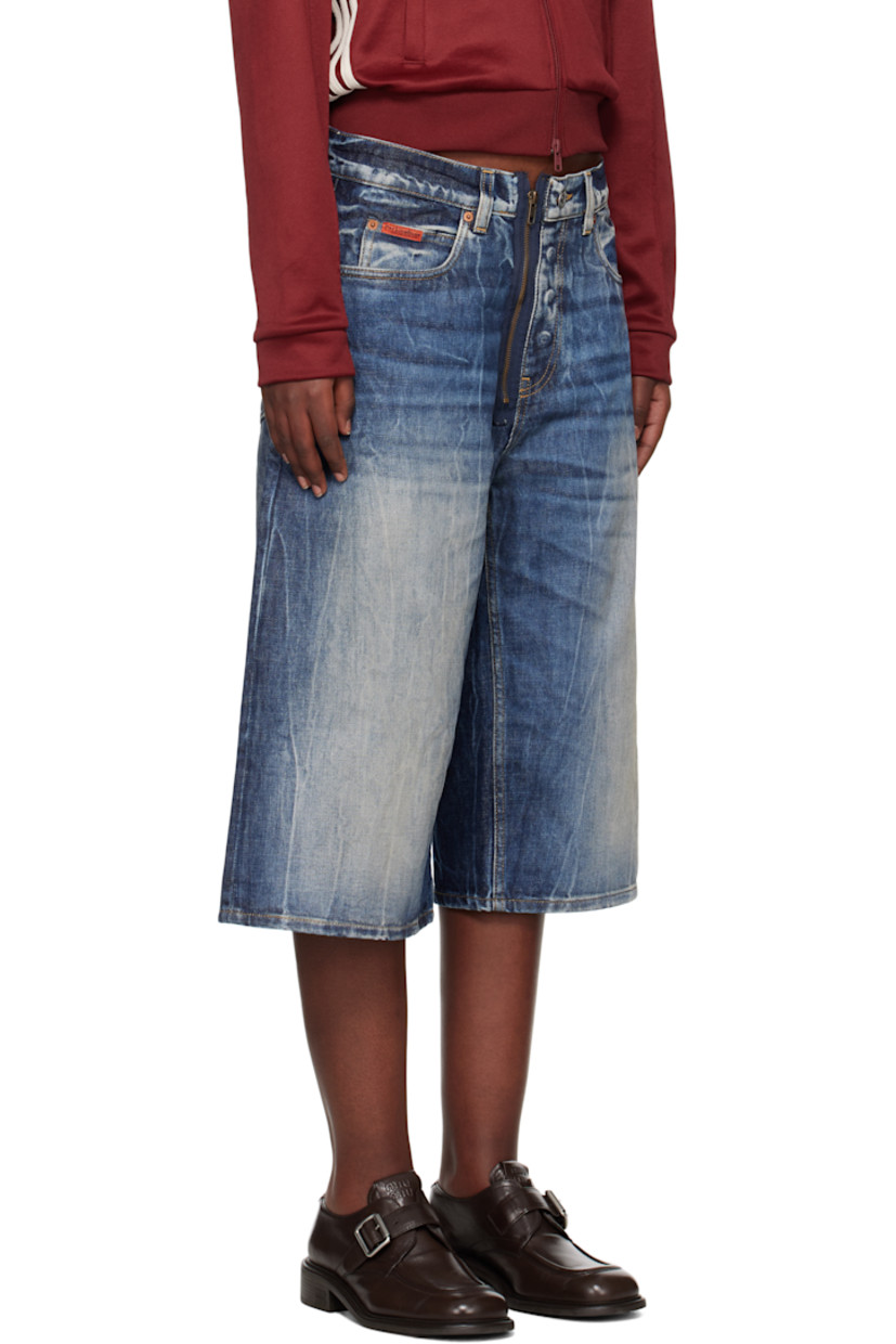Non-stretch denim shorts. Bleaching, fading, and whiskering throughout. 

· Belt loops
· Five-pocket styling
· Exposed zip-fly
· Logo patch embroidered at coin pocket
· Logo patch at back waistband
· Contrast stitching in tan

Supplier color: Blue