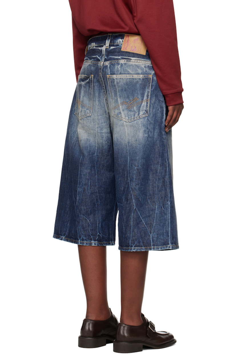 Non-stretch denim shorts. Bleaching, fading, and whiskering throughout. 

· Belt loops
· Five-pocket styling
· Exposed zip-fly
· Logo patch embroidered at coin pocket
· Logo patch at back waistband
· Contrast stitching in tan

Supplier color: Blue