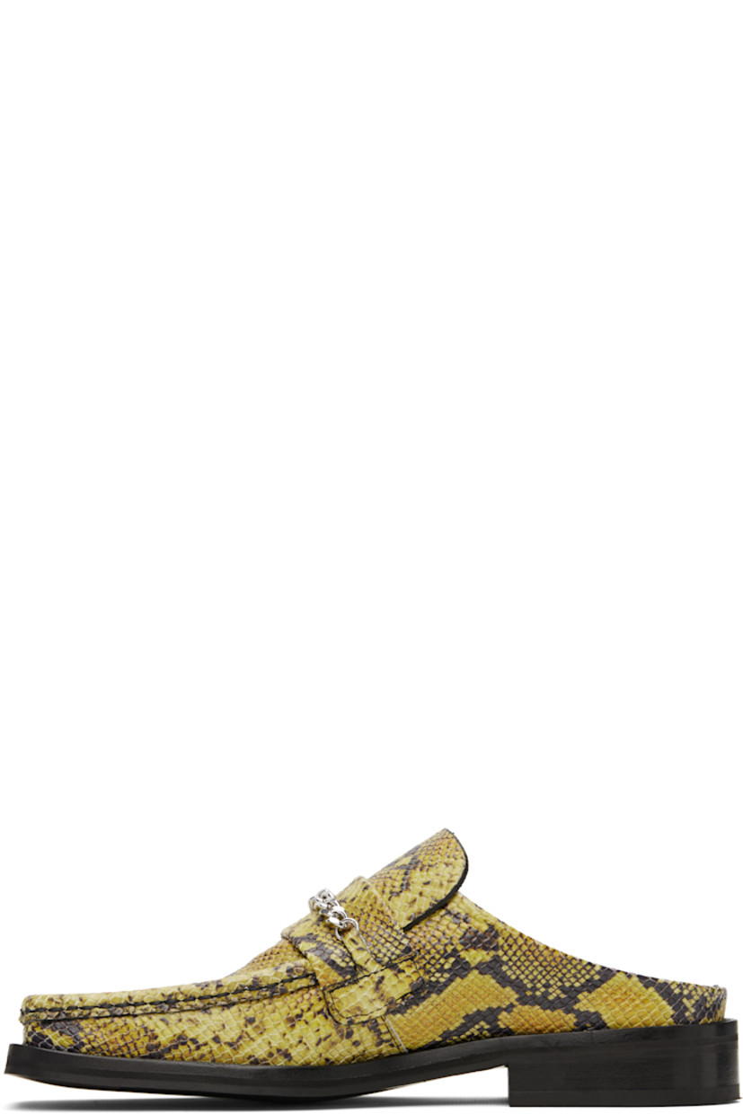 Snake-embossed leather mules in yellow and black.

· Square moc toe
· Strap and curb chain at vamp
· Stacked leather heel and midsole
· Polished leather sole with rubber injections
· Silver-tone hardware
· Heel: H1.25"

Supplier color: Yellow/Black