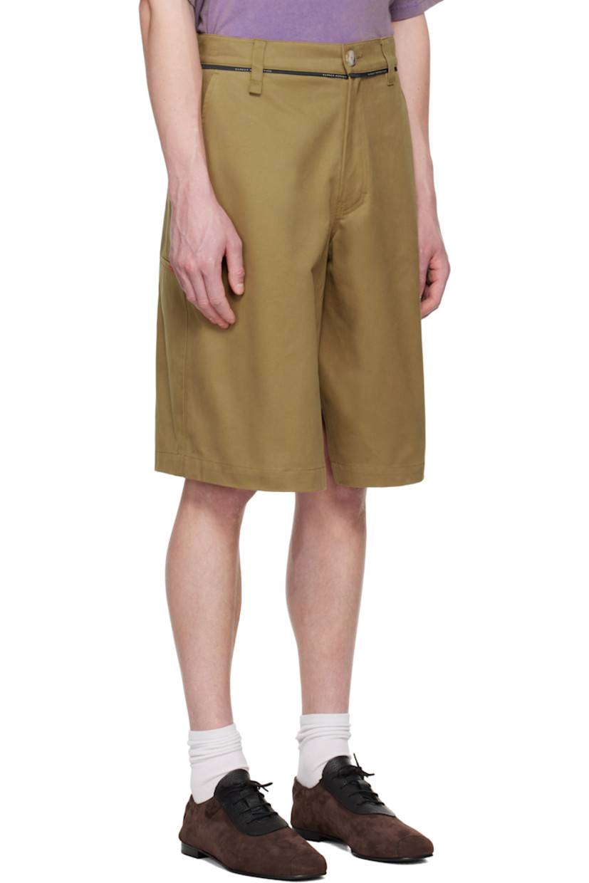 Wide-leg cotton canvas shorts.

· Belt loops and text-woven trim at waistband
· Four-pocket styling
· Zip fly
· Logo embroidered at front
· Modified gusset at inseams
· Logo patch at outseams
· Welt pocket at outseam
· Hammer loop and eyelets at outseam

Supplier color: Beige