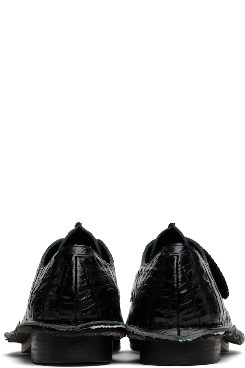 Croc-embossed leather derbys.

· Square toe
· Pinched seam at vamp and welt
· Logo tag at lace-up closure
· Buffed leather lining
· Stacked leather heel
· Leather sole

Part of the Martine Rose x Clarks collaboration.

Supplier color: Black