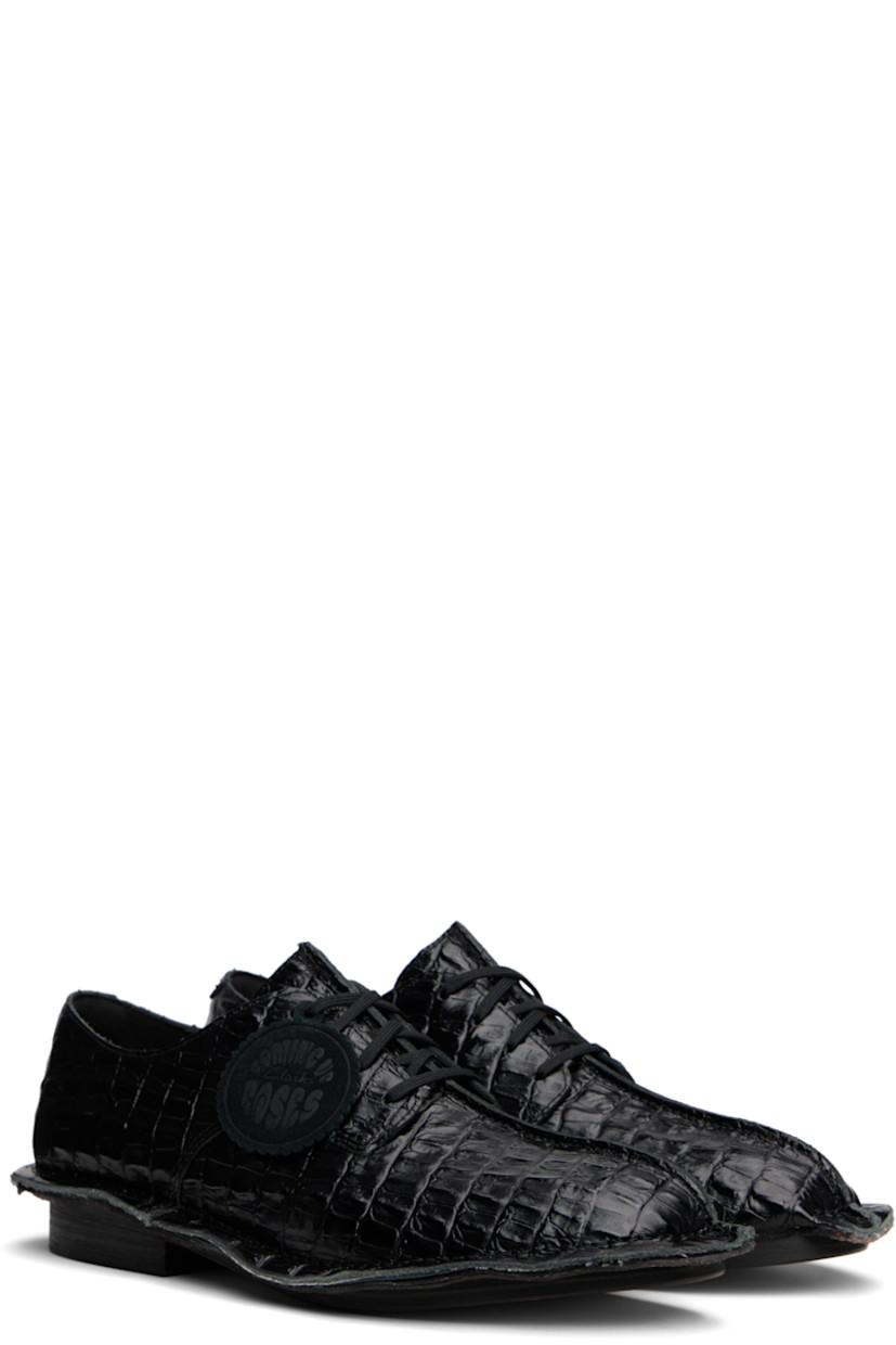 Croc-embossed leather derbys.

· Square toe
· Pinched seam at vamp and welt
· Logo tag at lace-up closure
· Buffed leather lining
· Stacked leather heel
· Leather sole

Part of the Martine Rose x Clarks collaboration.

Supplier color: Black
