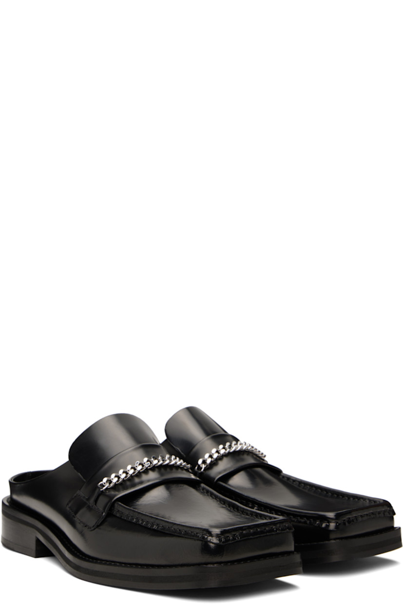 Polished calfskin mules in black.

· Square moc toe
· Strap and curb chain at vamp
· Stacked leather heel and midsole
· Polished leather sole with rubber injections
· Silver-tone hardware
· Heel: H1.25"

Supplier color: Black