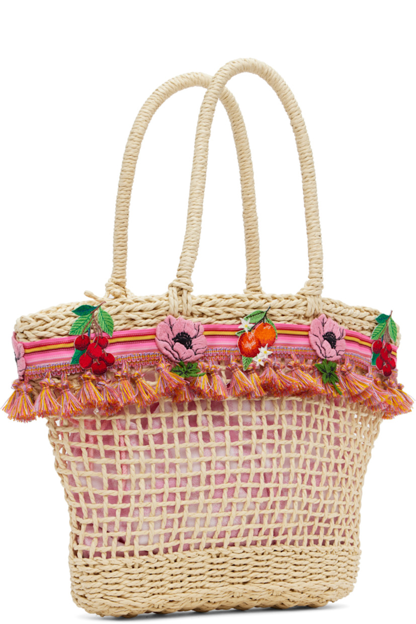 Woven raffia top handle bag in beige. Striped grosgrain trim with tassels and embroidered graphics throughout.

· Fixed carry handles
· Removable pink terrycloth drawstring bag at interior 
· H11" x W14" x D3.5"

Supplier color: Pink