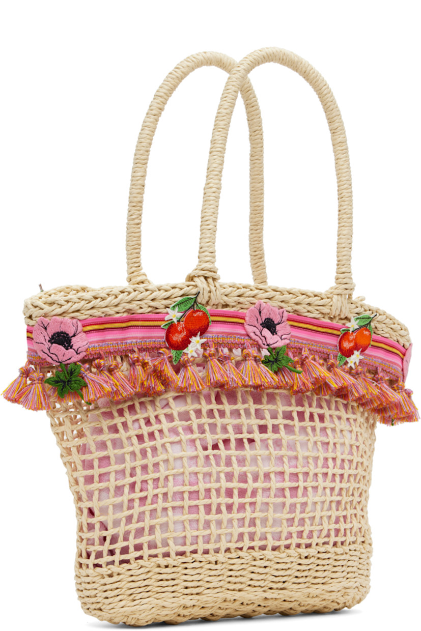 Woven raffia top handle bag in beige. Striped grosgrain trim with tassels and embroidered graphics throughout.

· Fixed carry handles
· Removable pink terrycloth drawstring bag at interior 
· H11" x W14" x D3.5"

Supplier color: Pink