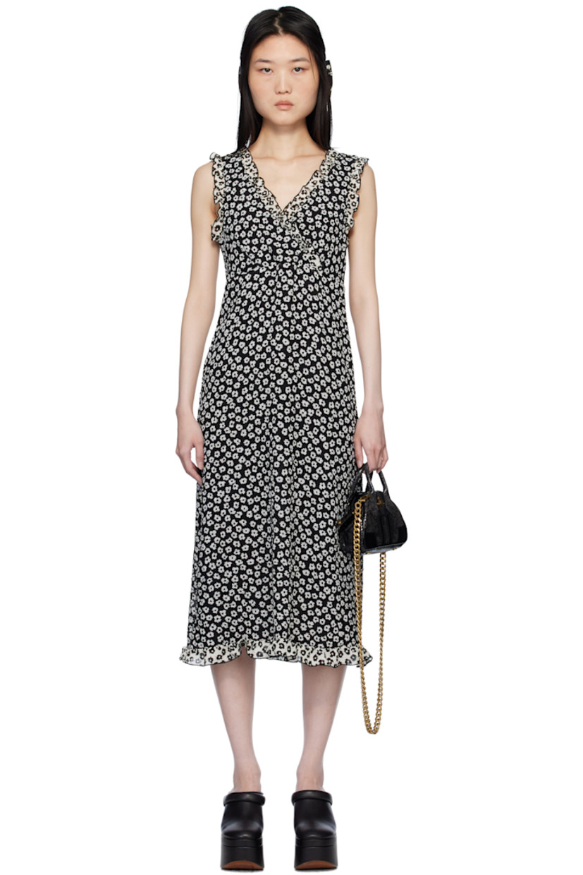 Polyester cloqué midi dress. Floral pattern and ruffled edges throughout.

· Criss-crossing V-neck
· Full crepe lining

Supplier color: Black/White
