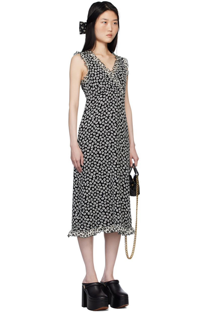 Polyester cloqué midi dress. Floral pattern and ruffled edges throughout.

· Criss-crossing V-neck
· Full crepe lining

Supplier color: Black/White