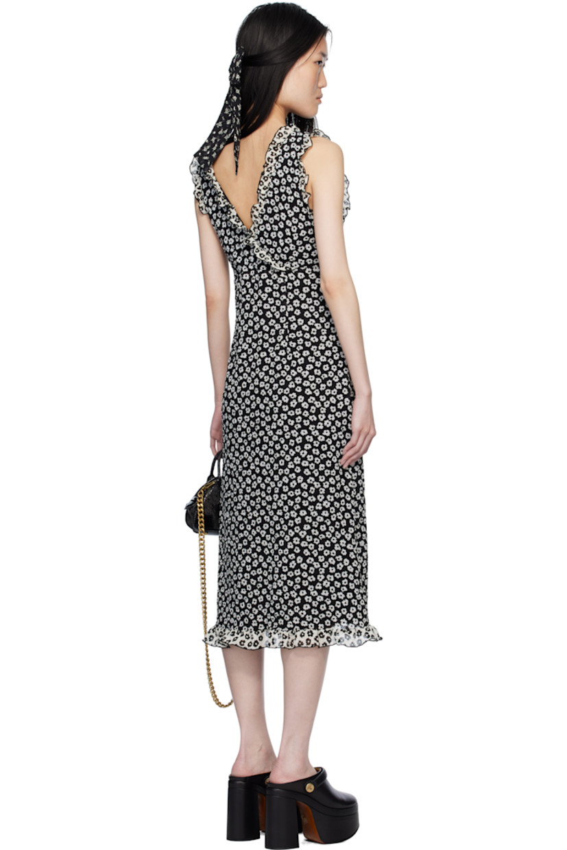 Polyester cloqué midi dress. Floral pattern and ruffled edges throughout.

· Criss-crossing V-neck
· Full crepe lining

Supplier color: Black/White