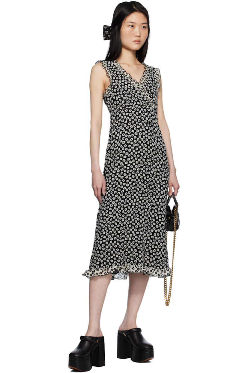 Polyester cloqué midi dress. Floral pattern and ruffled edges throughout.

· Criss-crossing V-neck
· Full crepe lining

Supplier color: Black/White