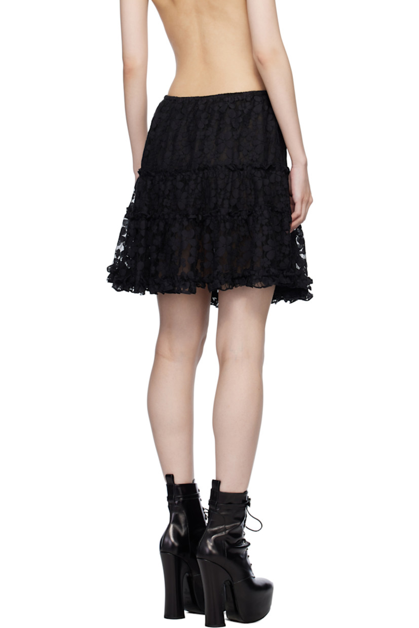 Nylon-blend tulle miniskirt. Floral lace trim and ruffled edges throughout.

· Tiered construction
· Elasticized waistband
· Fully lined

Supplier color: Black