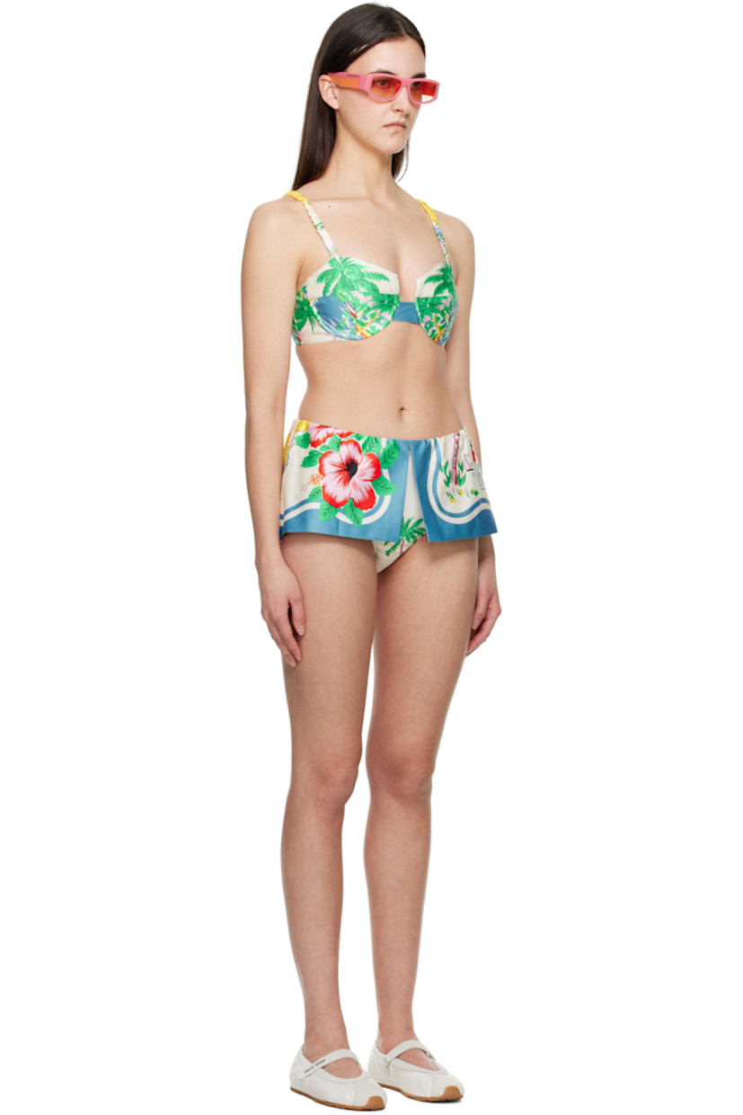 Cotton satin bikini top. Graphic pattern printed throughout.

· Sweetheart neck
· Underwire at cups
· Elasticized spaghetti straps
· Elasticized hook-eye fastening at back
· Full jersey lining

Cotton satin bikini bottom. Graphic pattern printed throughout.

· Foldover elasticized waistband
· Full jersey lining

Supplier color: Blue/Multi