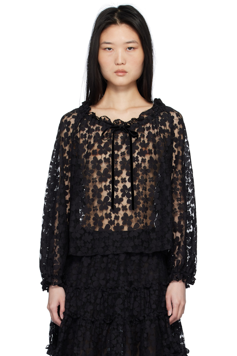 Nylon-blend tulle blouse. Floral lace trim throughout.

· Ruffled trim at boat neck and cuffs
· Velvet bow at collar

Supplier color: Black