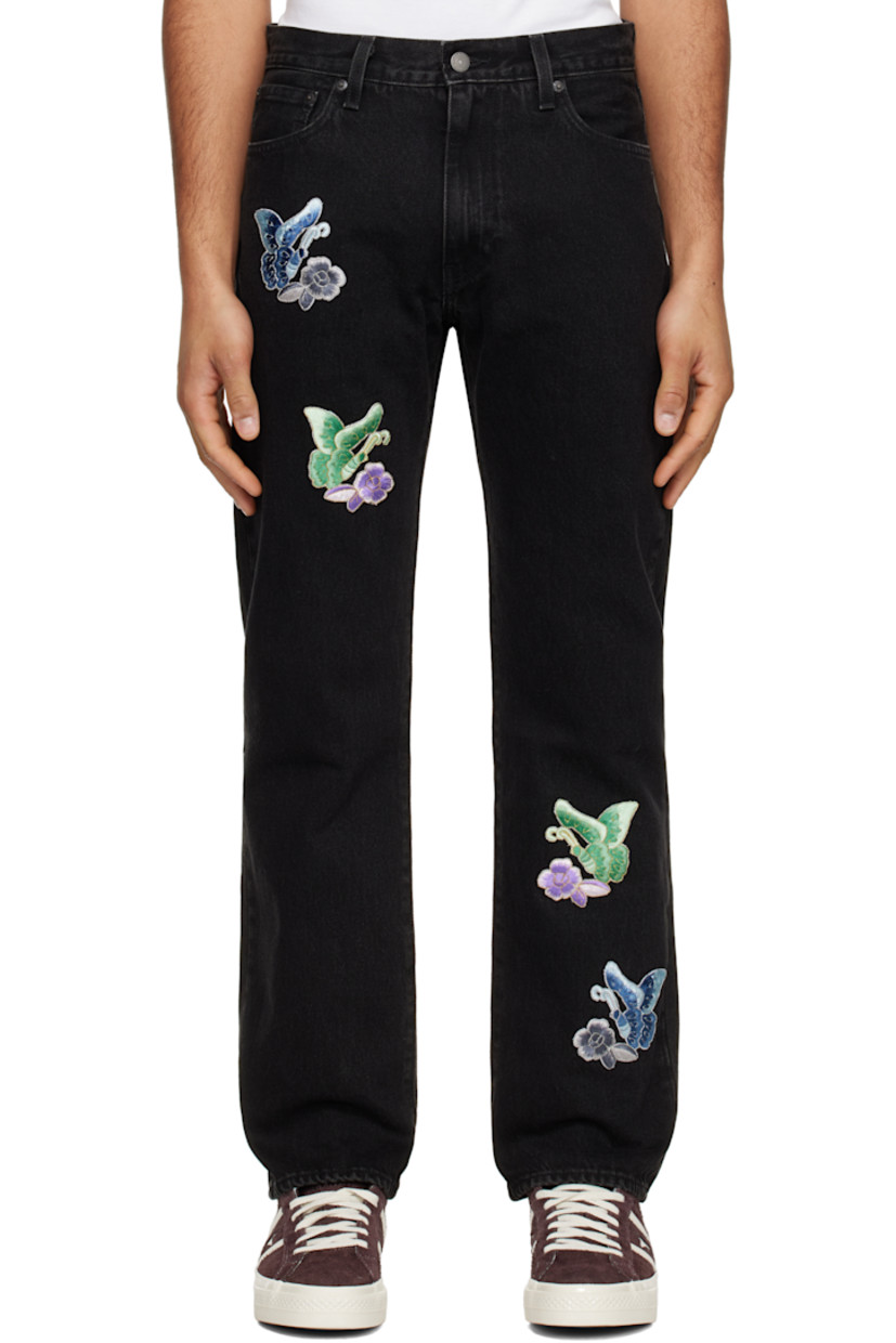 Non-stretch denim jeans. Fading throughout. 

· Belt loops
· Five-pocket styling
· Zip-fly
· Embroidered graphic appliqués at front 
· Leather logo patch at back waistband
· Logo flag at back pocket
· Logo-engraved copper-tone hardware

Supplier color: Washed black