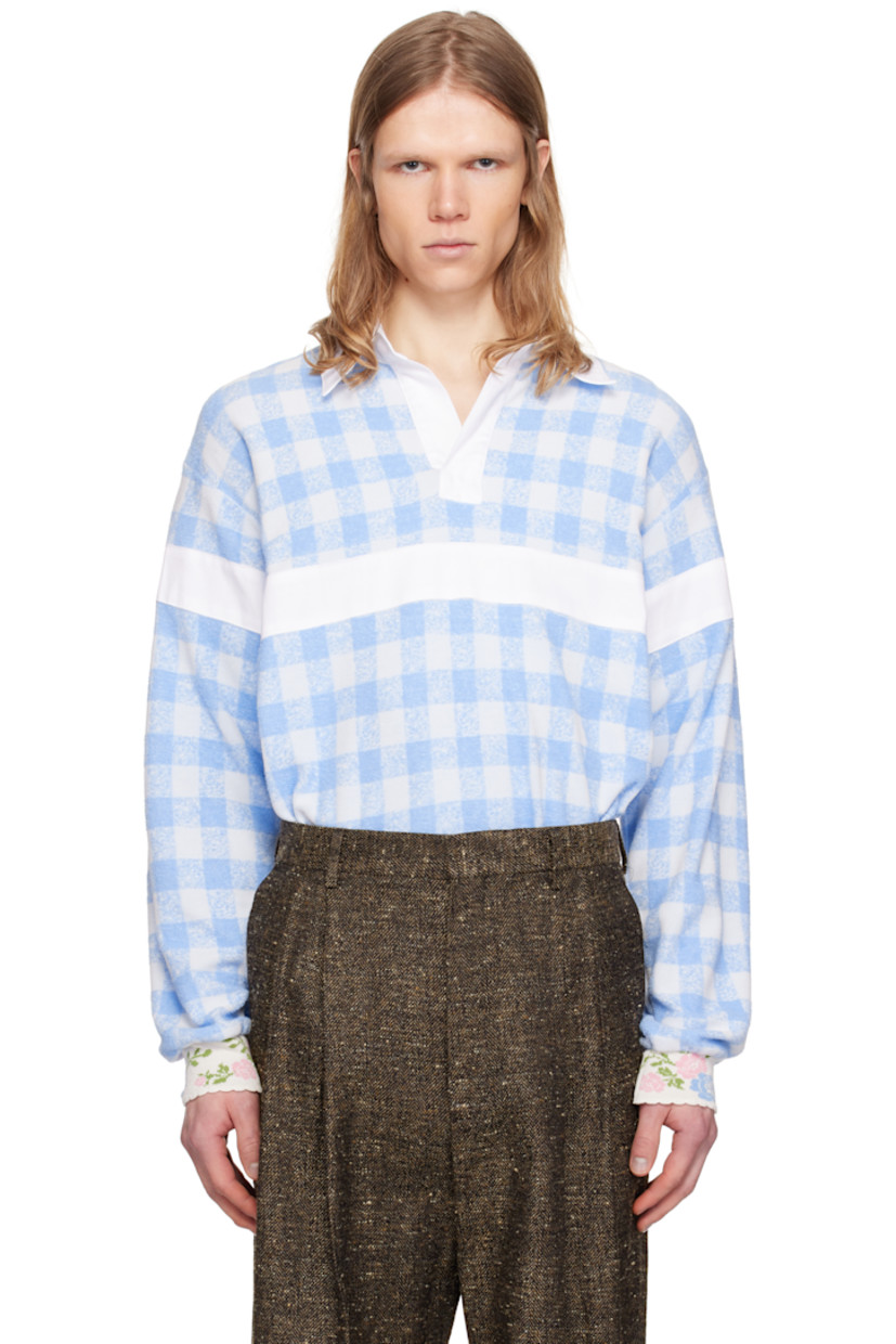 Loose-fit polyester- and cotton-blend terrycloth polo. Gingham pattern throughout.

· Spread collar
· Open placket
· Panel at chest, sleeves, and back
· Dropped shoulders
· Jacquard floral pattern at rib-knit cuffs
· Scalloped edge at cuffs

Supplier color: Baby blue