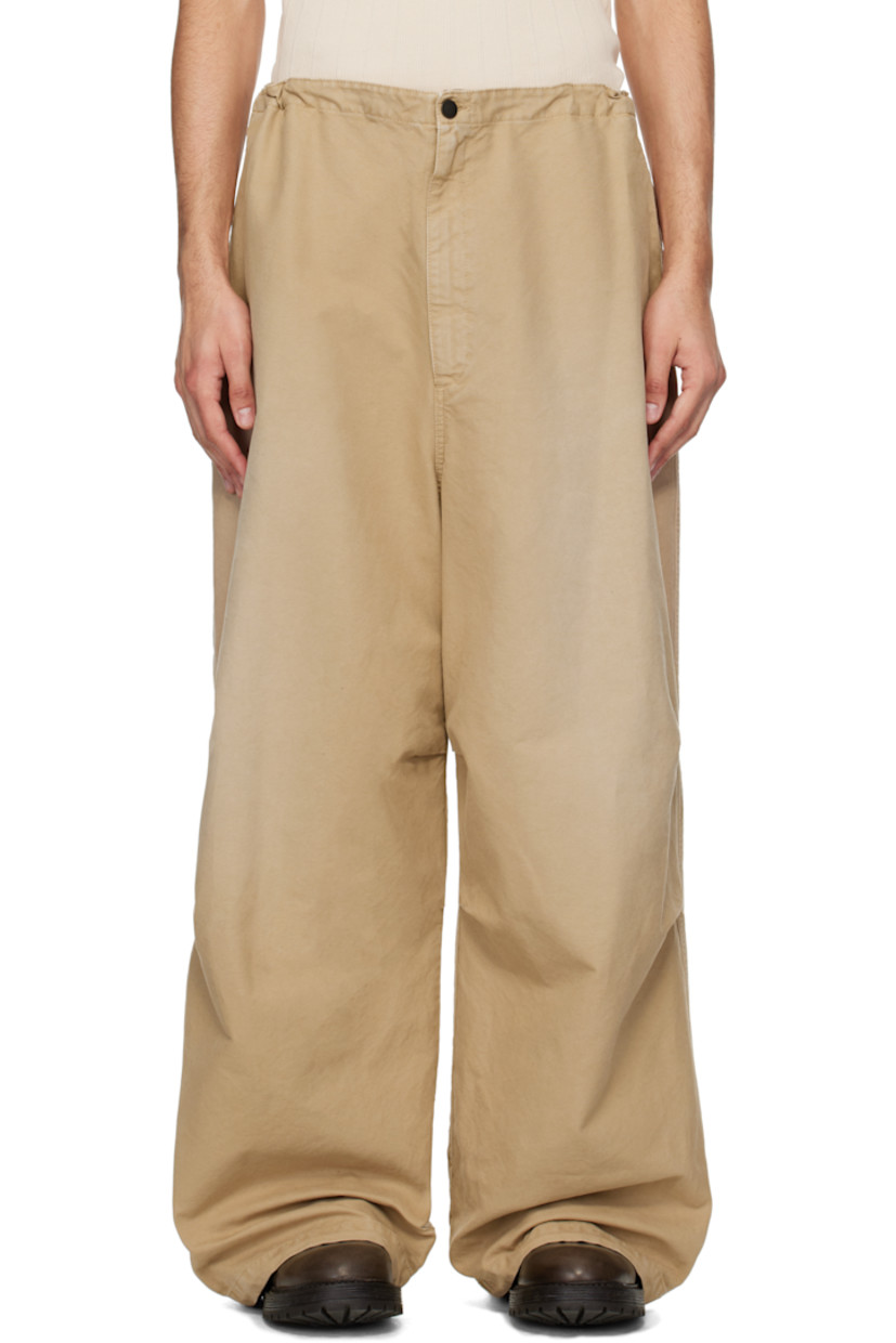 Cotton canvas trousers. Fading throughout.

· Concealed drawstring at waistband and cuffs
· Three-pocket styling
· Zip fly
· Logo flag at front pocket
· Pleats at knees
· Logo patch at back waistband

Supplier color: Beige/Khaki