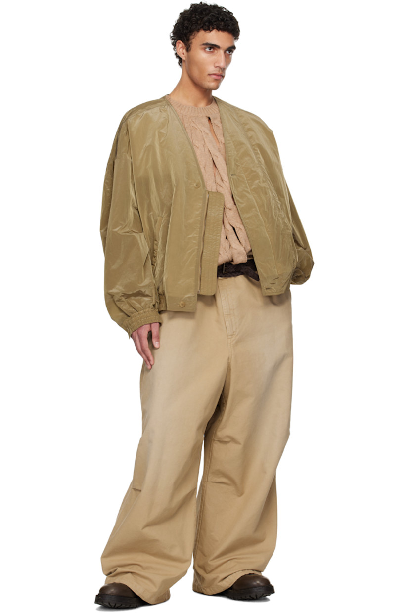Cotton canvas trousers. Fading throughout.

· Concealed drawstring at waistband and cuffs
· Three-pocket styling
· Zip fly
· Logo flag at front pocket
· Pleats at knees
· Logo patch at back waistband

Supplier color: Beige/Khaki