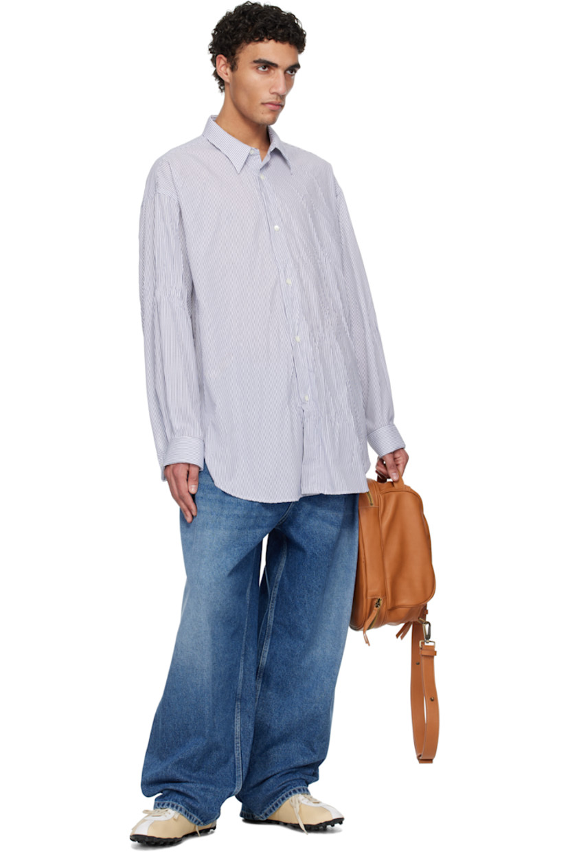 Crinkled polyester- and cotton-blend poplin shirt. Stripe pattern throughout.

· Spread collar
· Button closure
· Shirttail hem
· Buttoned French cuffs
· Box pleat at yoke

Supplier color: Natural