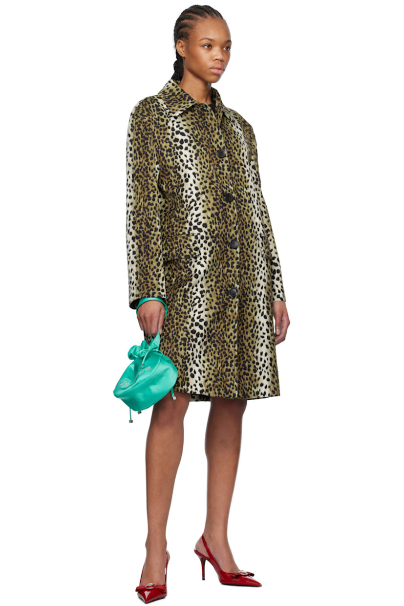 Satin pouch in green. 

· Wristlet at side
· Crystal-cut logo appliqué at face
· Drawstring closure
· Fully lined
· H6" x W7" x D3"

Supplier color: Sea green