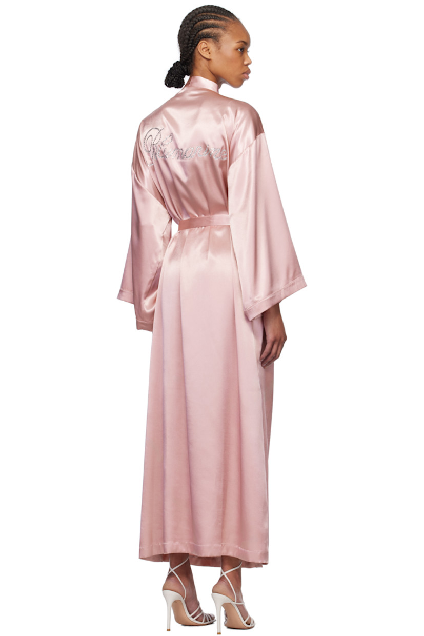 Polyester satin robe. 

· Shawl collar
· Belt loops with detachable self-tie belt
· Integrated self-tie fastening at interior
· Seam pockets
· Dropped shoulders 
· Crystal-cut logo appliqués at back

Supplier color: Eyeshadow pink