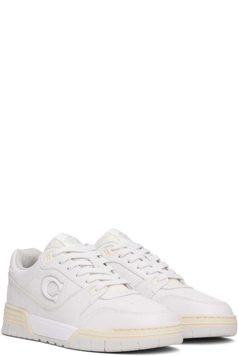 Low-top buffed leather sneakers.

· Perforated detailing at toe
· Lace-up closure
· Logo patch at padded tongue
· Padded collar
· Logo appliqué at outer side and heel counter
· Mesh lining
· Treaded rubber sole

Supplier color: Optic white