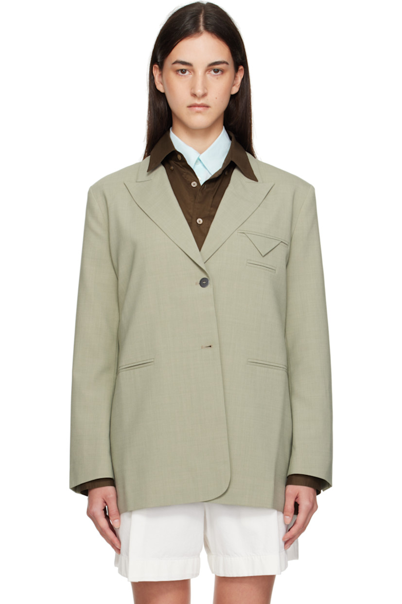 Woven stretch virgin wool-blend blazer.

· Peaked lapel
· Two-button closure
· Welt pockets at chest and waist
· Buttoned surgeon's cuffs
· Vented back hem
· Full satin lining
· Black metal hardware

Supplier color: Salvia