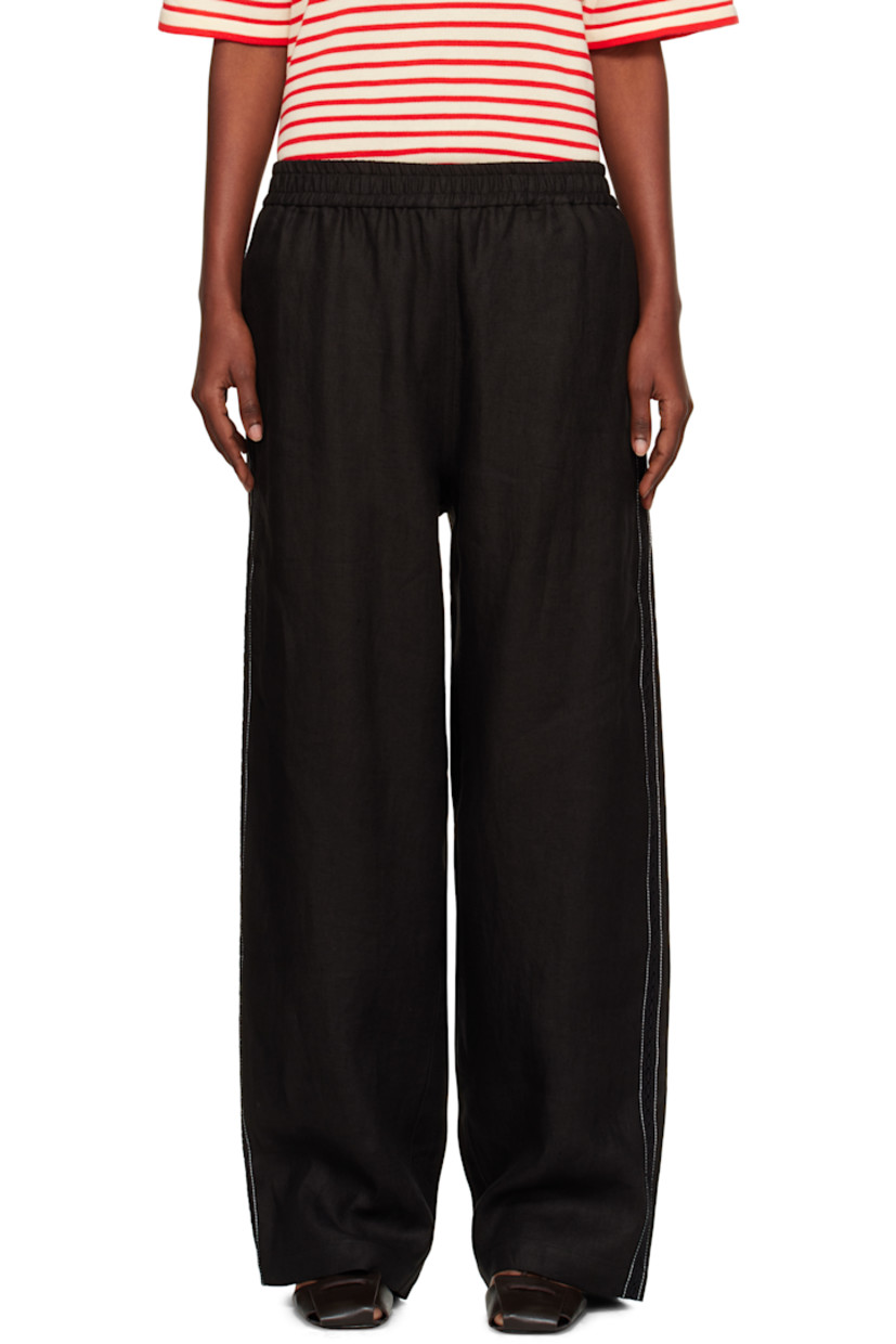 Linen twill trousers.

· Straight-leg
· Elasticized waistband
· Lace trim and contrast stitching at outseams
· Mock pockets at back

Supplier color: Black
