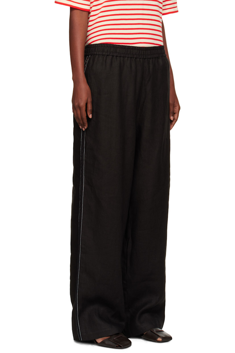 Linen twill trousers.

· Straight-leg
· Elasticized waistband
· Lace trim and contrast stitching at outseams
· Mock pockets at back

Supplier color: Black