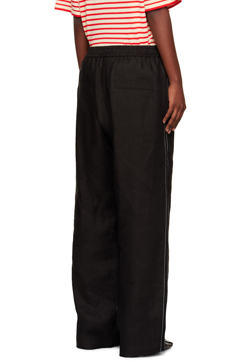 Linen twill trousers.

· Straight-leg
· Elasticized waistband
· Lace trim and contrast stitching at outseams
· Mock pockets at back

Supplier color: Black