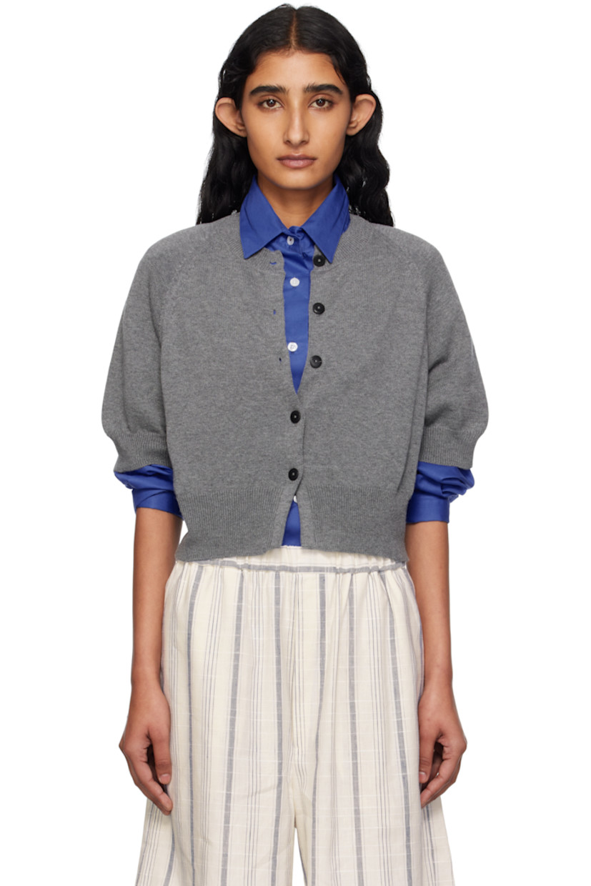 Knit organic cotton- and cashmere-blend cardigan. 

· OEKO-TEX® Standard 100-, ZDHC-, and BCI-certified
· Rib-knit crewneck, hem, and cuffs
· Button closure
· Cropped hem
· Raglan sleeves
· Logo-engraved hardware

Supplier color: Grey