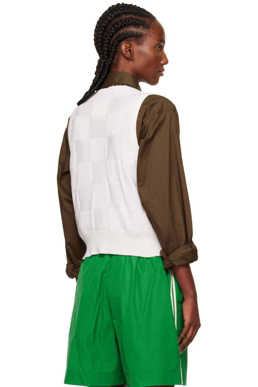 Knit cotton- and cashmere-blend vest.

· Certified OEKO-TEX® Standard 100, ZDHC, BCI
· Check pattern throughout
· Rib-knit V-neck, hem, and armscyes
· Scalloped edge at V-neck
· Cropped hem

Supplier color: White