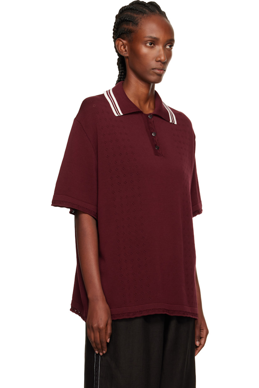 Knit long-staple organic cotton polo.

· Certified GOTS, OCS 100, and OEKO-TEX® Standard 100
· Pointelle detailing throughout
· Stripes at spread collar
· Three-button placket
· Dropped shoulders

Supplier color: Burgundy