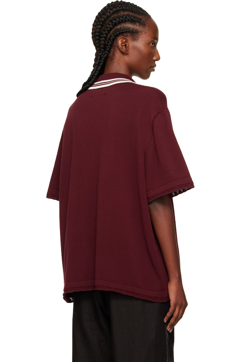 Knit long-staple organic cotton polo.

· Certified GOTS, OCS 100, and OEKO-TEX® Standard 100
· Pointelle detailing throughout
· Stripes at spread collar
· Three-button placket
· Dropped shoulders

Supplier color: Burgundy