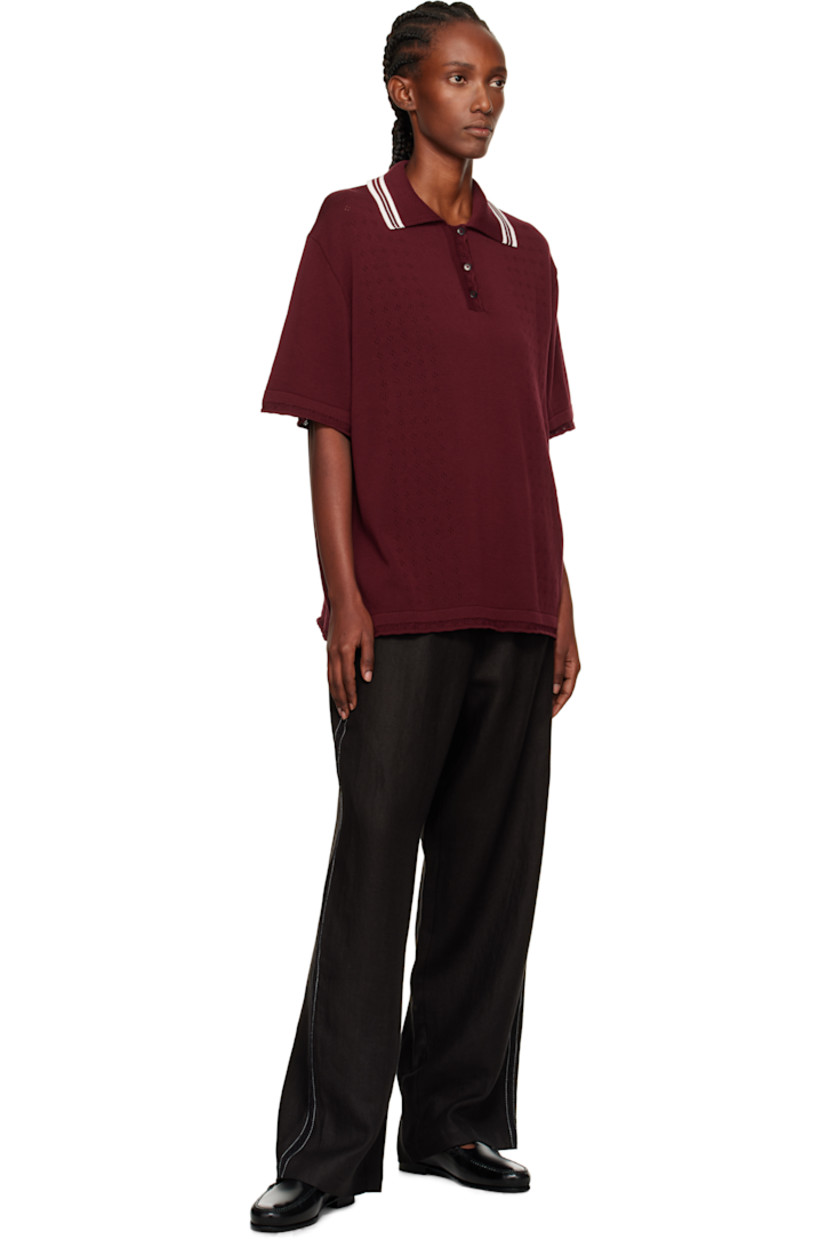Knit long-staple organic cotton polo.

· Certified GOTS, OCS 100, and OEKO-TEX® Standard 100
· Pointelle detailing throughout
· Stripes at spread collar
· Three-button placket
· Dropped shoulders

Supplier color: Burgundy