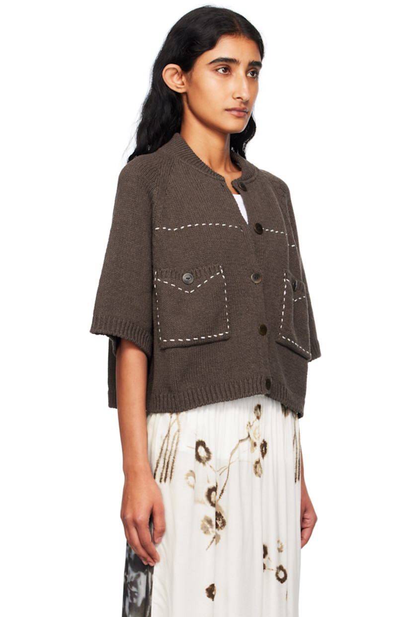 Knit ECOTEC® upcycled cotton-blend cardigan. 

· Certified GOTS and OEKO-TEX® Standard 100
· Rib-knit stand collar, hem, and cuffs
· Button closure
· Topstitching in white at front
· Patch pockets at waist
· Raglan sleeves
· Logo-engraved hardware

Supplier color: Brown