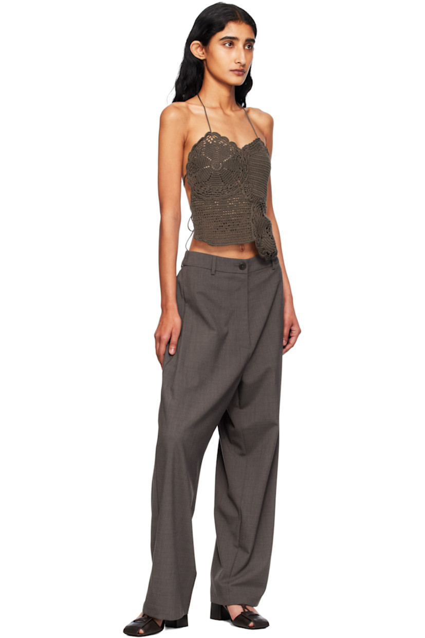 Hand-crocheted long-staple organic cotton top. 

· GOTS-, OCS 100-, and OEKO-TEX® Standard 100
· Scalloped edges throughout 
· Self-tie halter strap at V-neck
· Self-tie straps at open back

Supplier color: Brown