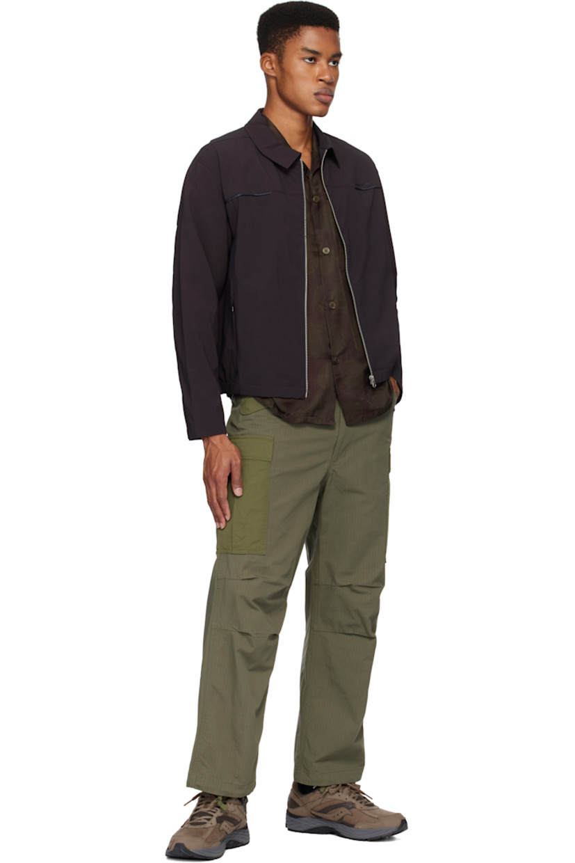 Low-top grained leather and nubuck sneakers in brown.

· Perforated detailing and reflective trim throughout
· Lace-up closure
· Logo patch at padded tongue
· Padded collar
· Logo appliqué at sides
· Logo embossed at outer side and heel tab
· Mesh lining
· ProGrid foam rubber midsole
· Treaded rubber sole

Supplier color: Otter/Caviar