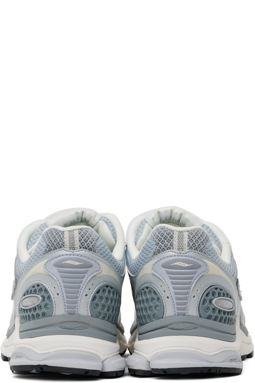 Low-top mesh and textured faux-leather sneakers in gray.

· Rubberized and bonded trim throughout
· Reflective trim at toe
· Lace-up closure
· Logo patch at padded tongue
· Padded collar
· Logo appliqué at sides
· Arch-Lock technology at footbed
· Mesh lining
· ProGrid foam rubber midsole
· Treaded XT-900 rubber sole

Supplier color: Light grey