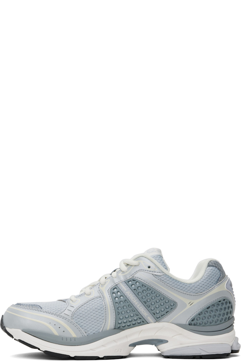 Low-top mesh and textured faux-leather sneakers in gray.

· Rubberized and bonded trim throughout
· Reflective trim at toe
· Lace-up closure
· Logo patch at padded tongue
· Padded collar
· Logo appliqué at sides
· Arch-Lock technology at footbed
· Mesh lining
· ProGrid foam rubber midsole
· Treaded XT-900 rubber sole

Supplier color: Light grey