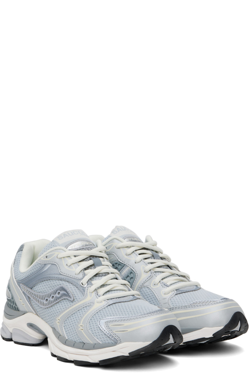 Low-top mesh and textured faux-leather sneakers in gray.

· Rubberized and bonded trim throughout
· Reflective trim at toe
· Lace-up closure
· Logo patch at padded tongue
· Padded collar
· Logo appliqué at sides
· Arch-Lock technology at footbed
· Mesh lining
· ProGrid foam rubber midsole
· Treaded XT-900 rubber sole

Supplier color: Light grey