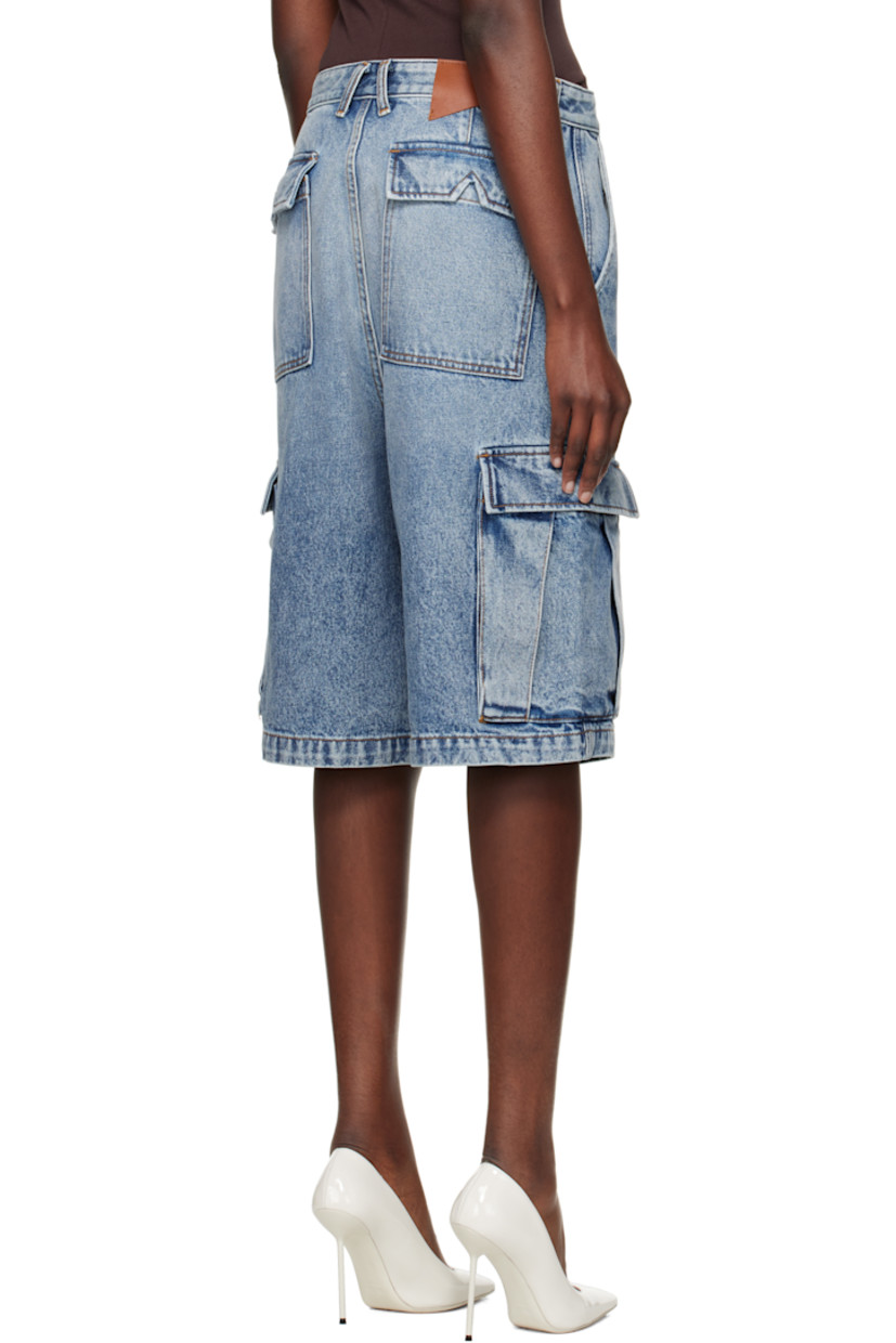Non-stretch denim cargo shorts. Fading and whiskering throughout.

· Belt loops
· Four-pocket styling
· Zip fly
· Cargo pocket at outseams
· Logo patch at back waistband

Supplier color: Bay indigo