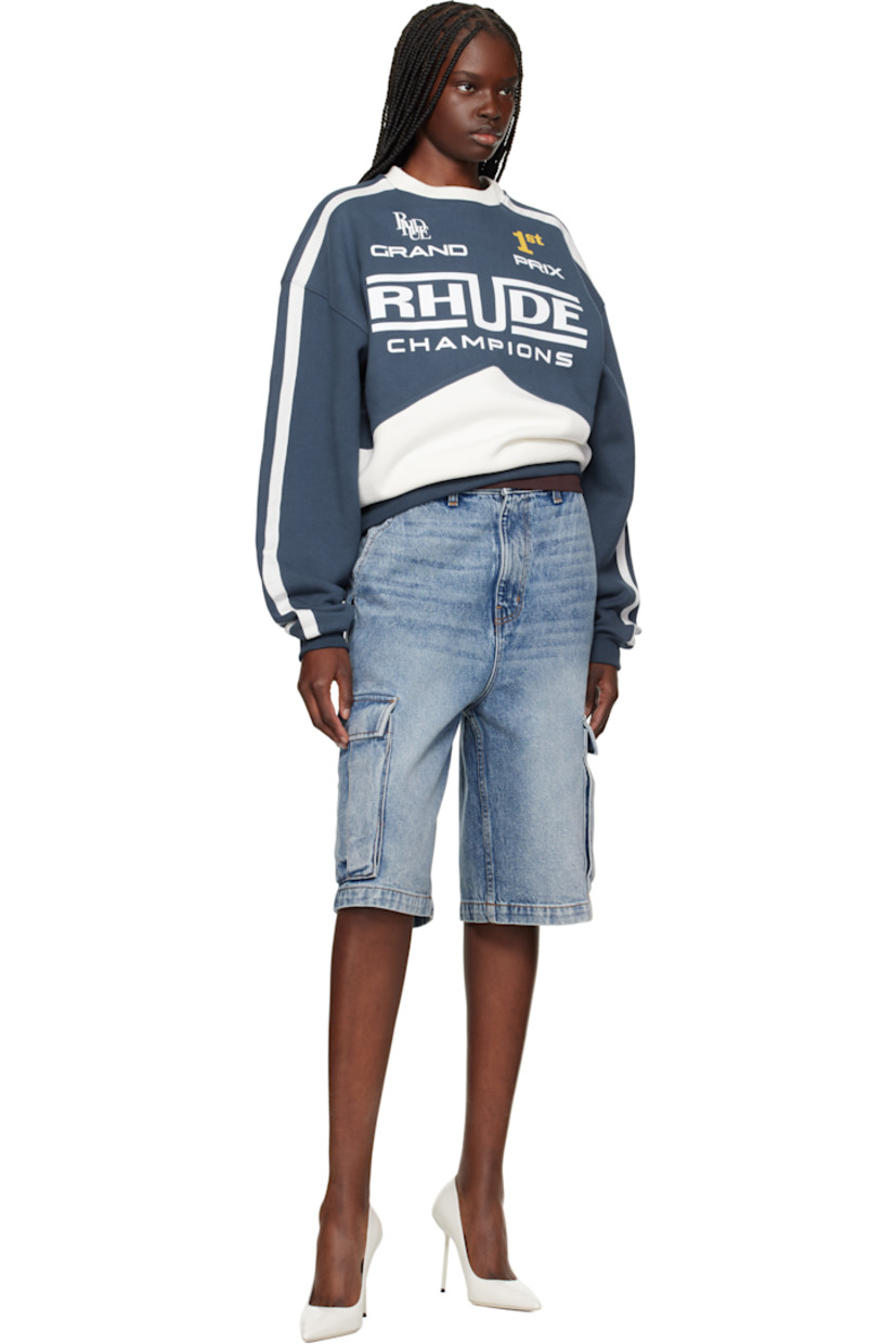 Non-stretch denim cargo shorts. Fading and whiskering throughout.

· Belt loops
· Four-pocket styling
· Zip fly
· Cargo pocket at outseams
· Logo patch at back waistband

Supplier color: Bay indigo