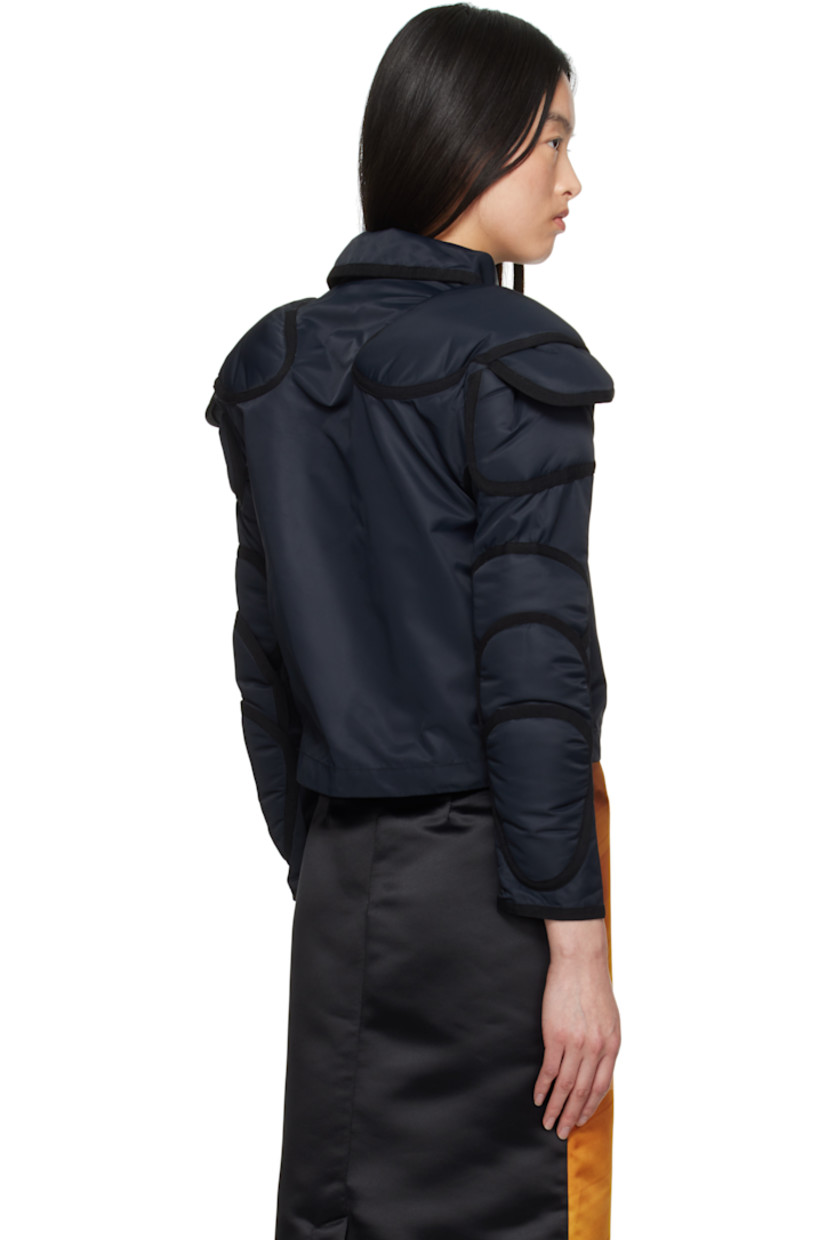 Nylon taffeta blazer.

· Peter Pan collar
· Button closure
· Vent at underarms
· Layered padded panels at raglan sleeves
· Unlined

Supplier color: Black